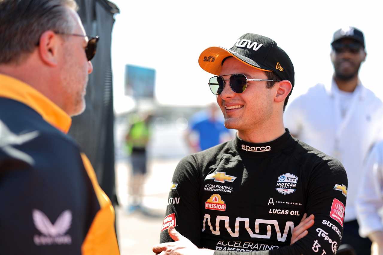 Arrow McLaren SP IndyCar driver Pato O'Ward talks with McLaren Racing CEO Zak Brown at the series' 2022 season-opener at St Pete.