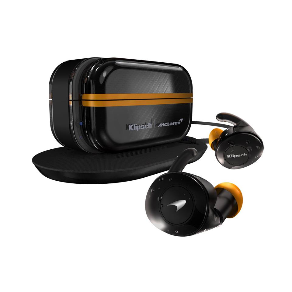 Klipsch McLaren F1 Edition wireless earbuds in front of the charging case