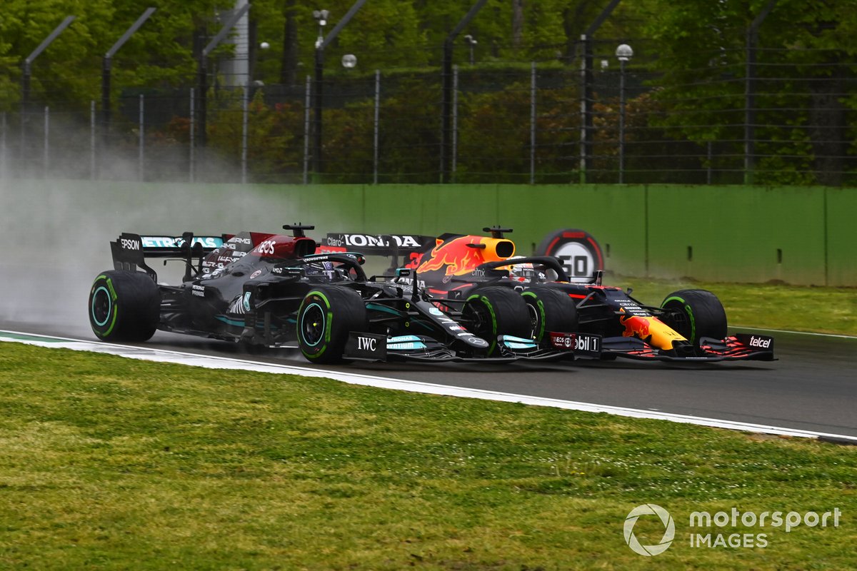 Lewis Hamilton and Max Verstappen go side-by-side into the first corner at the start