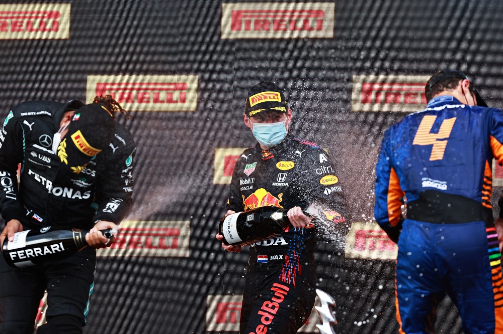 Verstappen, Hamilton and Norris spray Ferrari Trento