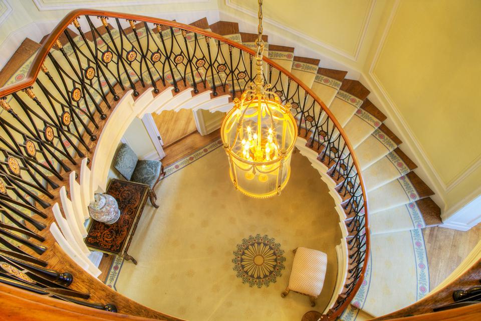 A spiral staircase leads to the second floor of the home. 