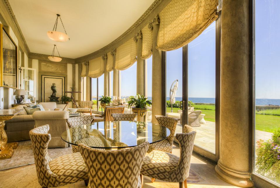 A seating area with expansive window provides ocean views and ample light. 