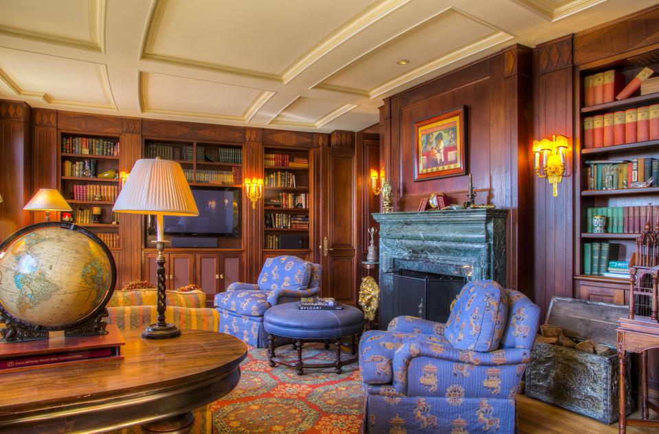 A paneled library is home to more than 4,500 books and one of Leno's favorite rooms in Seafair.