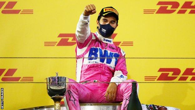 Race point driver Sergio Perez celebrates on the podium after winning the 2020 Sakhir race in Bahrain