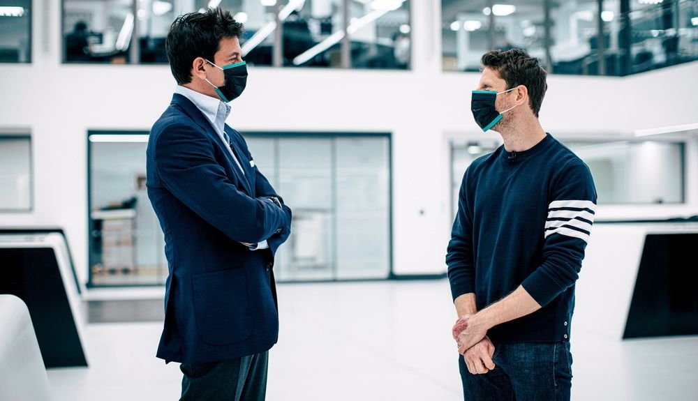 Romain Grosjean with Toto Wolff.  What is promised is debt
