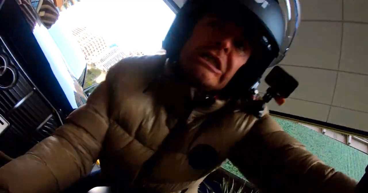 F1 champion Nico Rosberg crashes a motorcycle in Monaco and gets stuck under it