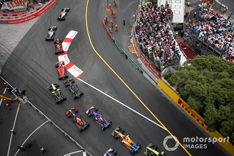 Lewis Hamilton, Mercedes AMG F1 W10, leads the field through the first corner