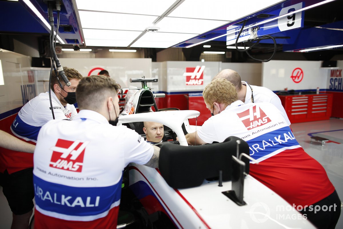 Nikita Mazepin, Haas F1, in cockpit in the team's garage