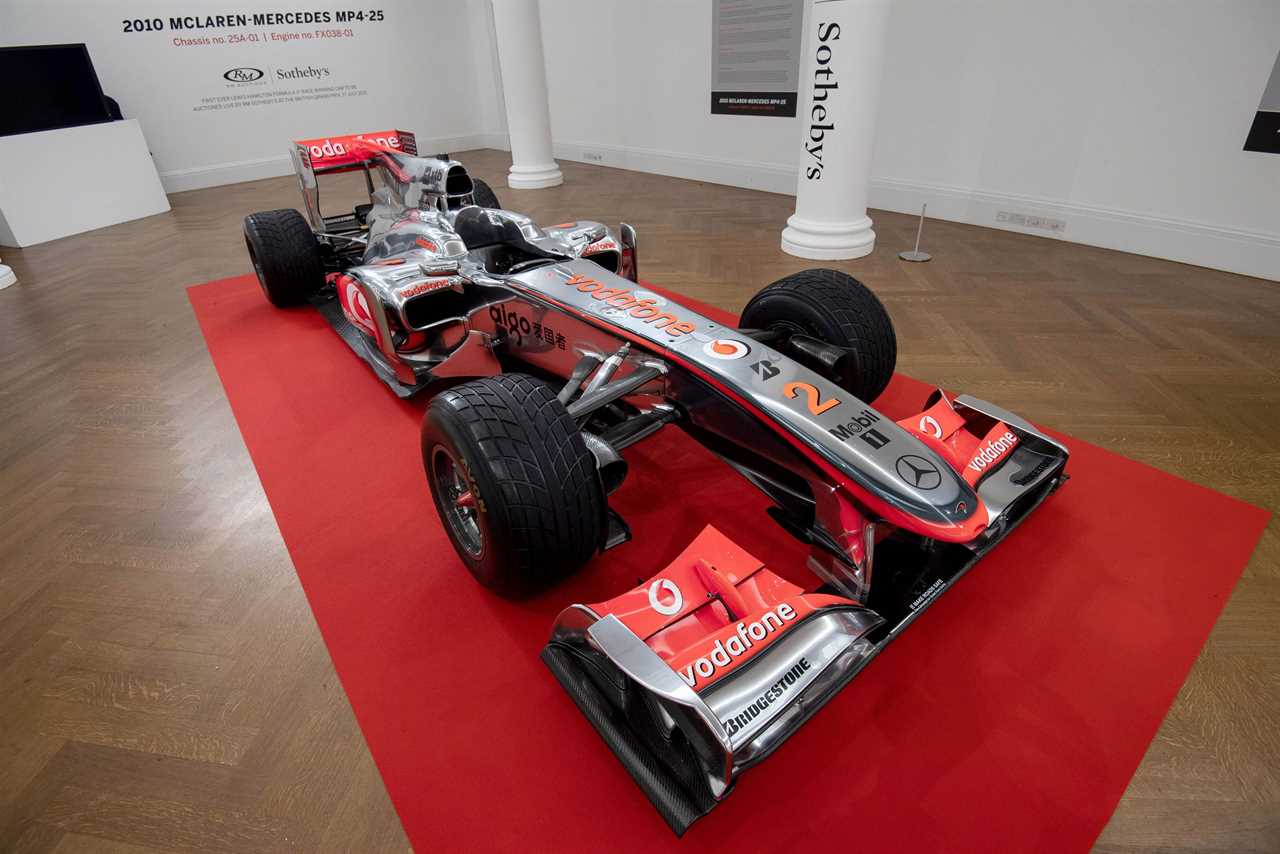 The McLaren is driven around Silverstone before being sold live at the British Grand Prix