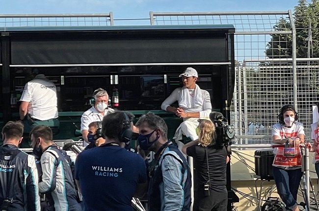George Russell on the Aston Martin F1 team's pit wall