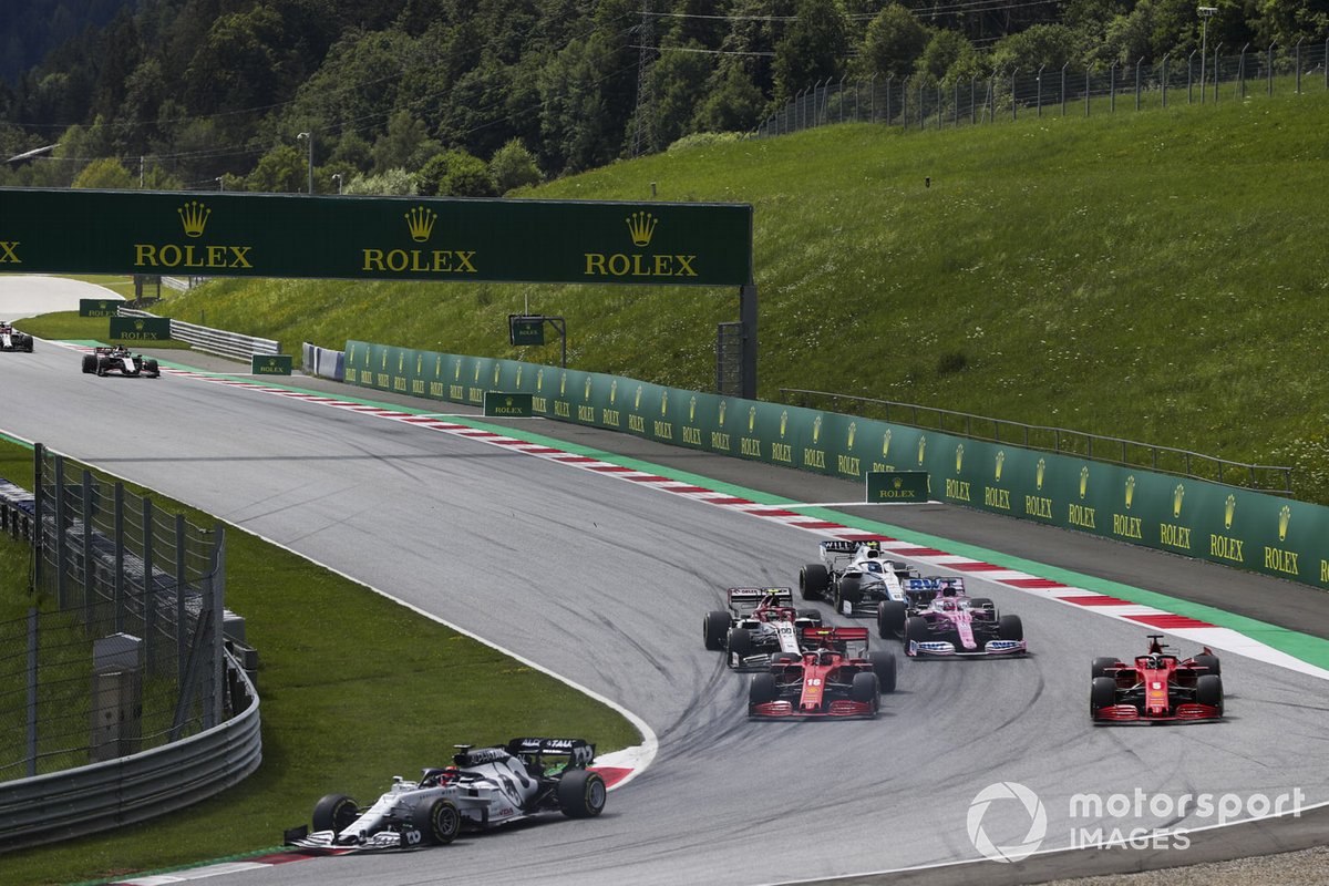 Daniil Kvyat, AlphaTauri AT01, is in the lead when Charles Leclerc, Ferrari SF1000, and Sebastian Vettel, Ferrari SF1000, collide on the first lap