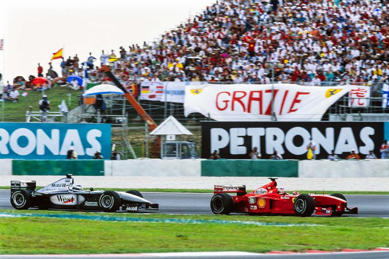 Michael Schumacher, Ferrari F399, leads Mika Häkkinen, McLaren MP4-14 Mercedes.