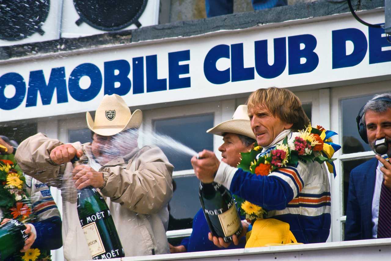 Bell uncorks the champagne for the fifth time after taking a second win on the bounce alongside Holbert and Stuck in 1987
