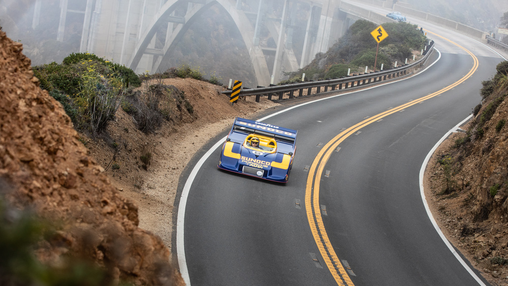 A 1973 Porsche 917/30 Can-Am Spyder cruises along the coast during the 2021 Pebble Beach Tour d'Elegance.