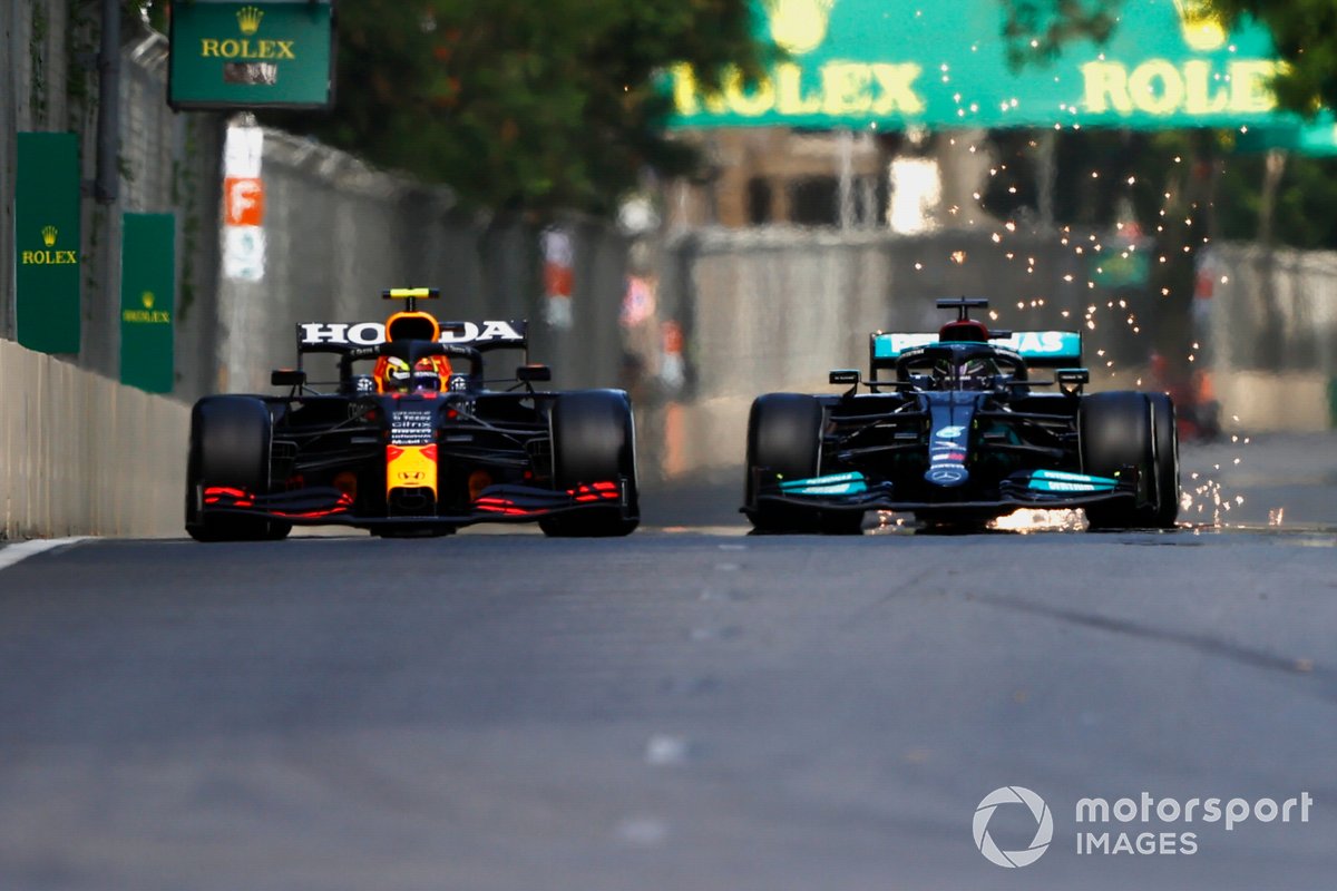 Sergio Perez, Red Bull Racing RB16B, fights with Lewis Hamilton, Mercedes W12
