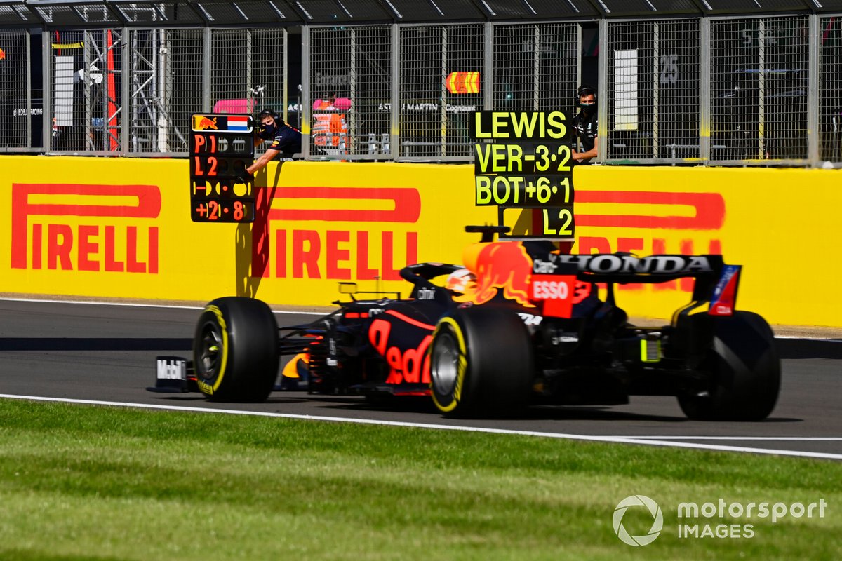 Max Verstappen, Red Bull Racing RB16B, passes his pit board