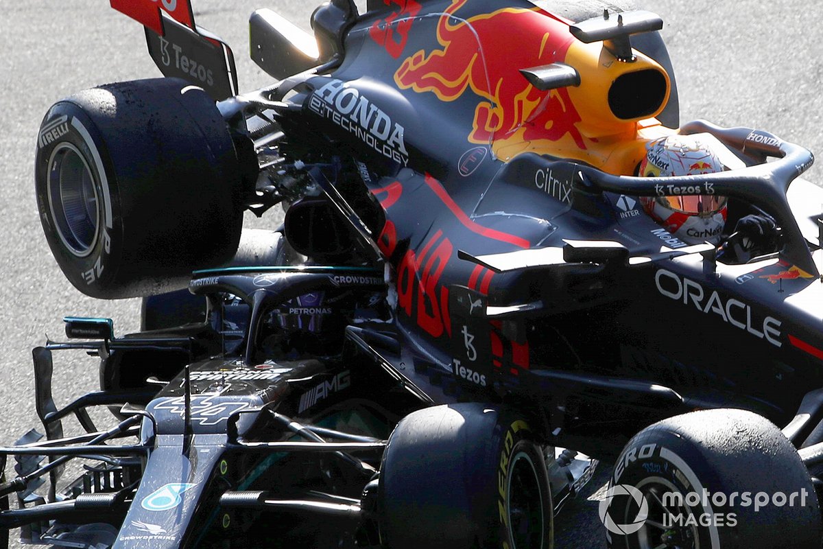 Max Verstappen, Red Bull Racing RB16B, and Lewis Hamilton, Mercedes W12, crash out