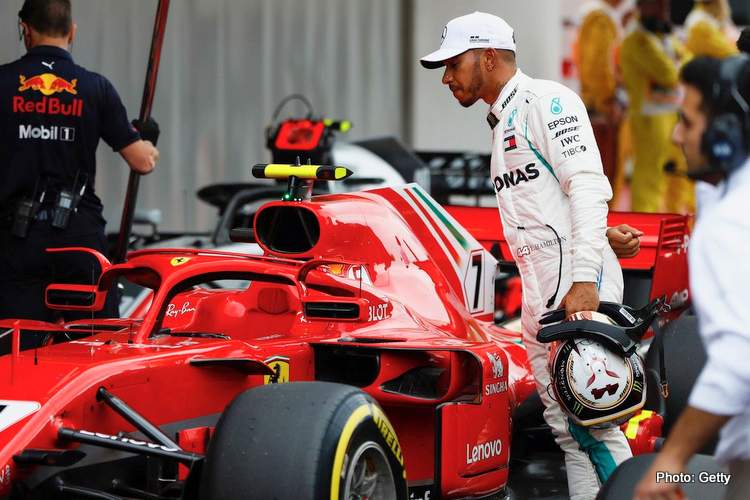 Hamilton looks at Ferrari