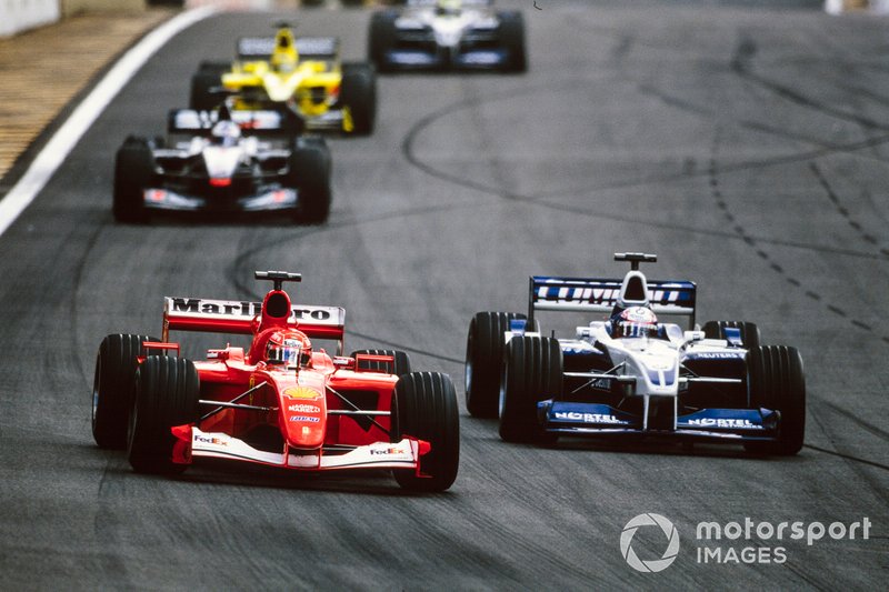 Michael Schumacher, Ferrari F2001, fights with Juan Pablo Montoya, Williams FW23 BMW