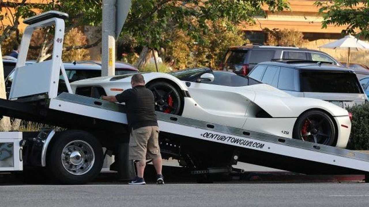 Lewis Hamilton pays a tow truck to move his car after he finishes driving