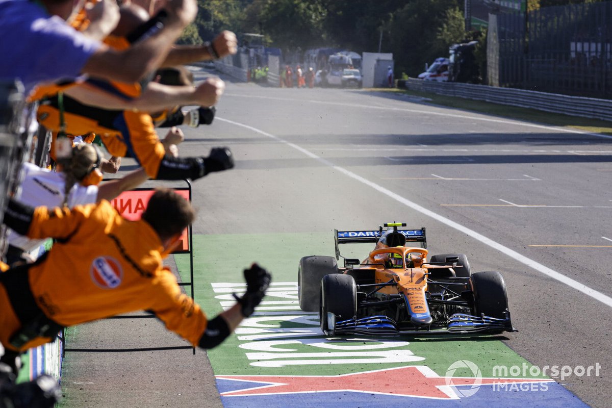 Lando Norris, McLaren MCL35M, 2nd position, takes victory as his team cheers from the pit wall