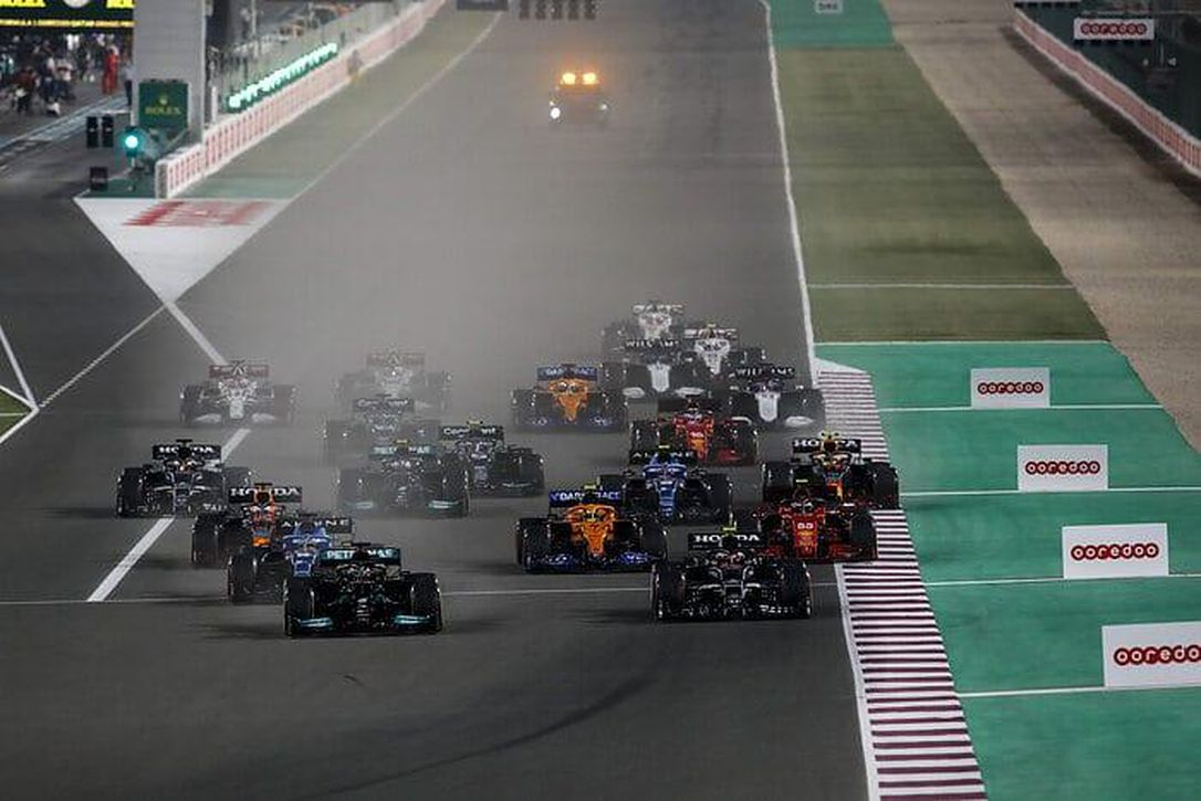 The field thunders toward the first turn at the start of the new Qatar Grand Prix.
