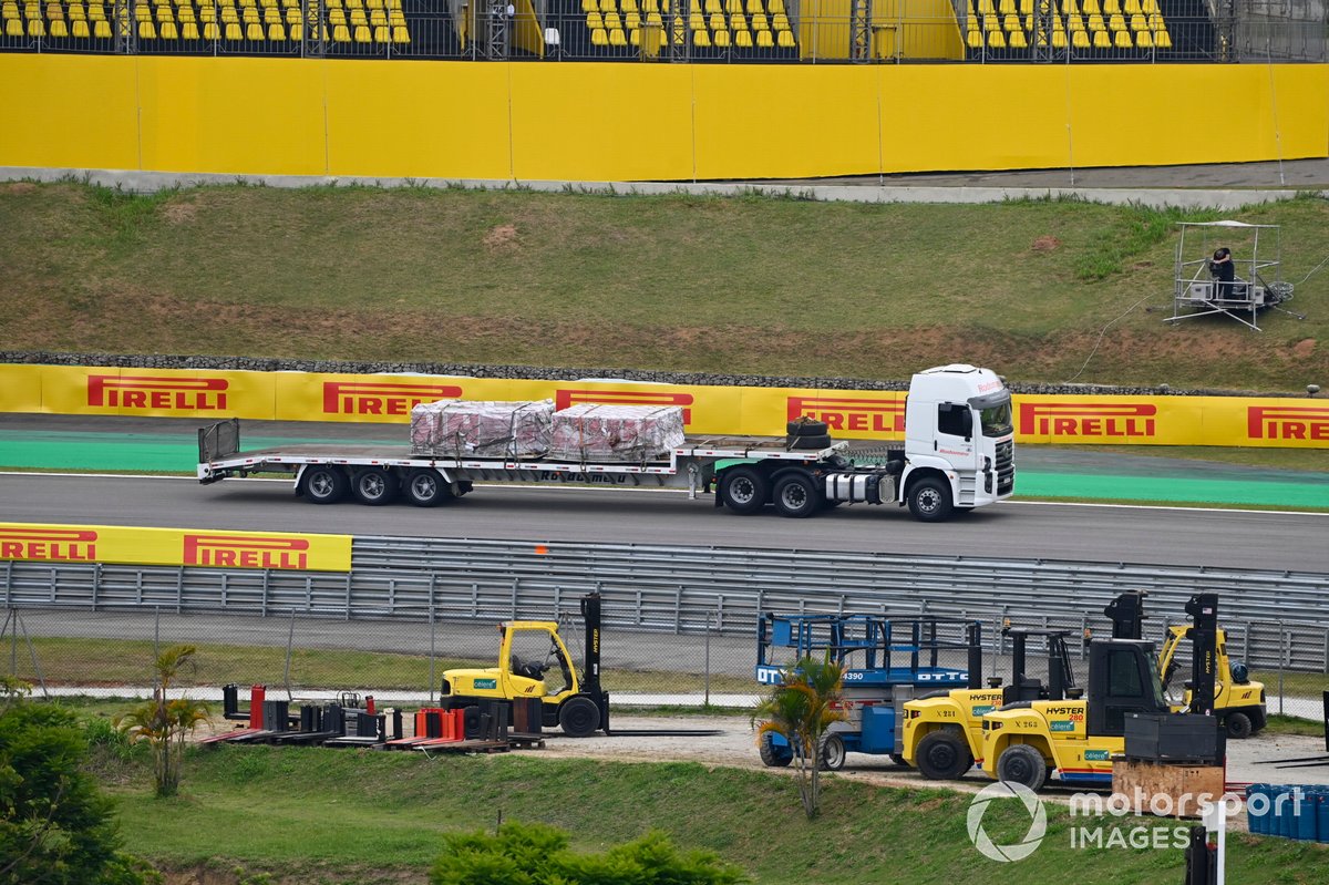 Trucks delivering equipment to the track