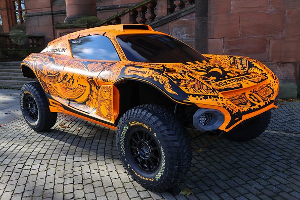 Who builds extreme e-cars while Rosberg's team is taking them for the title?