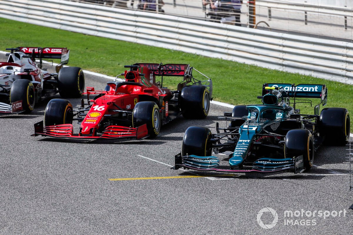 The cars of Charles Leclerc, Ferrari SF21, and Sebastian Vettel, Aston Martin AMR21 