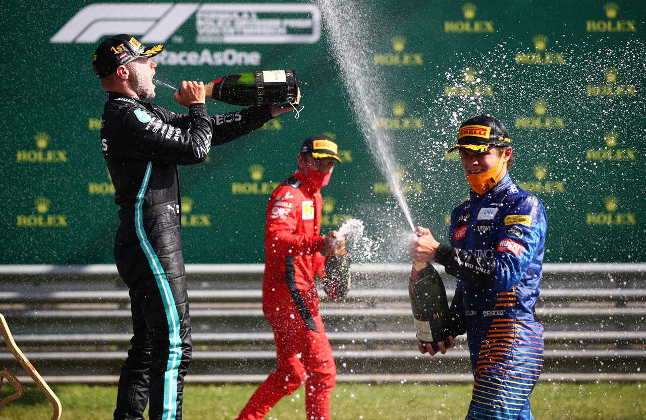 lr mercedes finnish driver valtteri bottas, ferraris monegasque driver charles leclerc and mclarens british driver lando norris celebrate with champagne on the podium after the austrian formula 1 grand prix race on july 5th 2020 in spielberg, austria photo by mark thompson pool afp photo by mark thompsonpoolafp via Getty Images