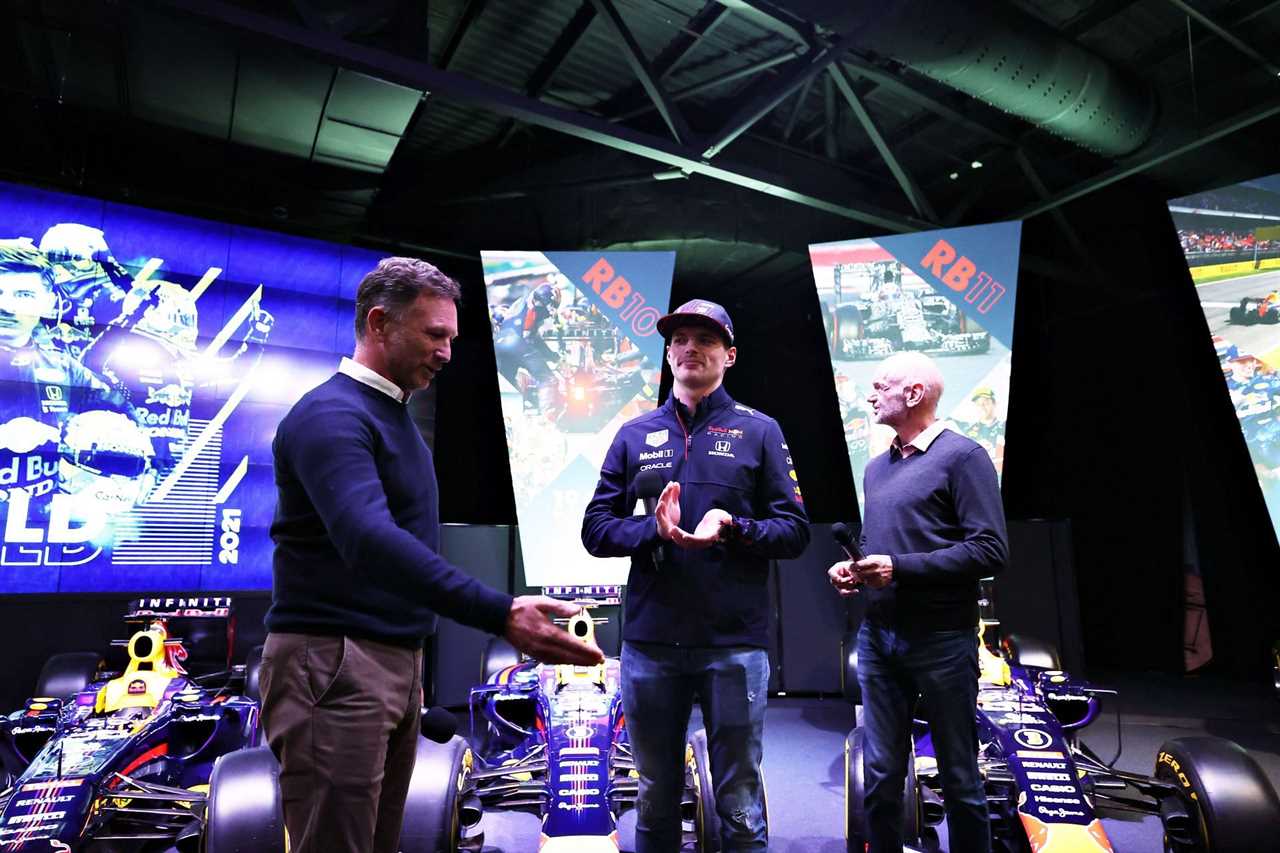 F1 world champion Max Verstappen (center) at Red Bull Racing Factory with team principal Christian Horner (left) and chief technology officer Adrian Newey (right)