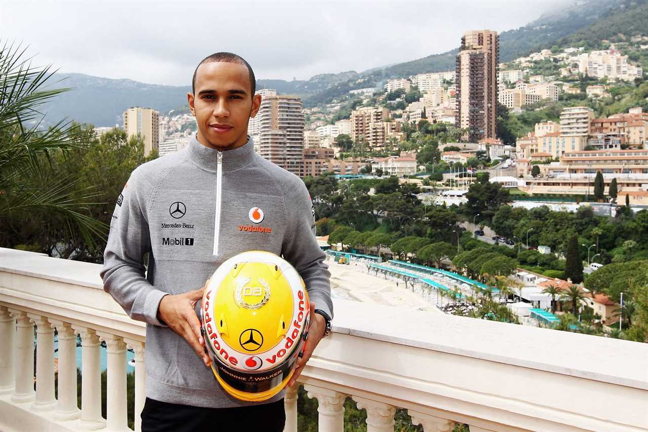 Lewis Hamilton shows a special diamond-encrusted helmet to celebrate his 2008 World Championship in Monte Carlo, Monaco (Photo by Paul Gilham/Getty Images)