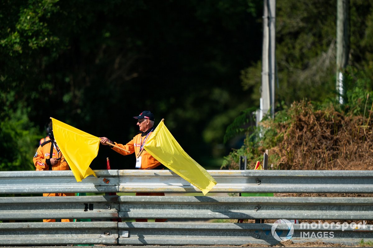 Marshal waves double waved yellow flags