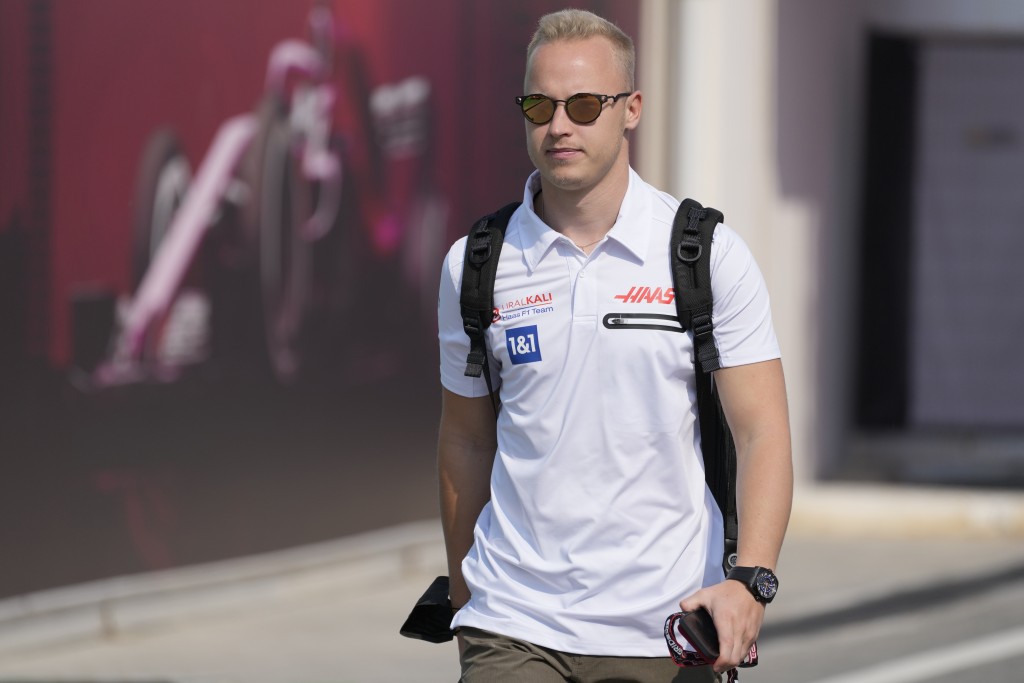 FILE - Haas driver Nikita Mazepin of Russia arrives to the Losail International Circuit in Losail, Qatar, Thursday, Nov. 18, 2021 ahead of the Qatar F...