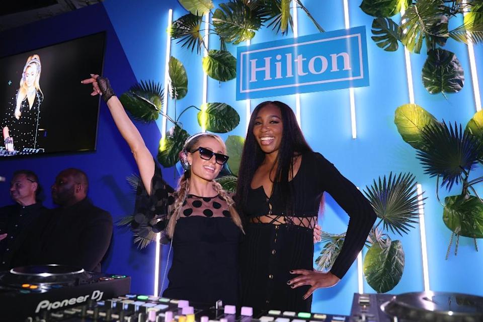 Paris Hilton and Venus Williams attend an exclusive Miami Grand Prix event hosted by Hilton and McLaren Racing at Hilton Bentley Miami/South Beach in Miami Beach, Fla.  on May 7. - Credit: Jesus Aranguren/AP Images for Hilton