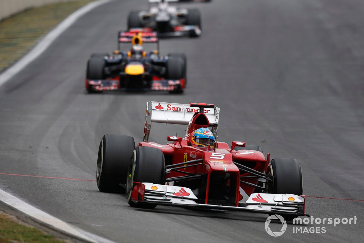 Fernando Alonso, Ferrari F2012, leads Sebastian Vettel, Red Bull RB8 Renault