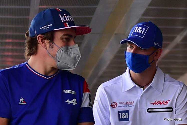 Fernando Alonso of Alpine F1 Team and Mick Schumacher of Uralkali Haas F1 Team go into press conference of Italian GP, ​​14th round of Formula 1 World Championship in Autodromo Internazionale di Monza, in Monza, Lombardia, Italy, 9 September 2021 aston martin f1 vettel