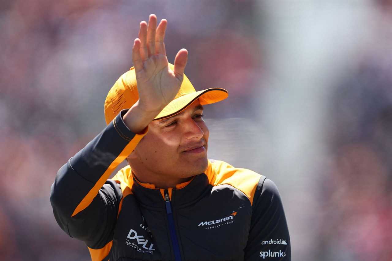 Lando Norris waves on the drivers' parade ahead of the 2022 F1 Grand Prix of Canada (Photo by Clive Rose/Getty Images)