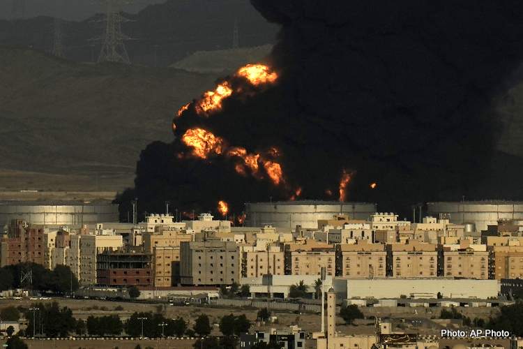 A cloud of smoke rises from a burning oil depot in Jiddah, Saudi Arabia, Friday, attack was March 25, 2022. (AP Photo/Hassan Ammar) F1