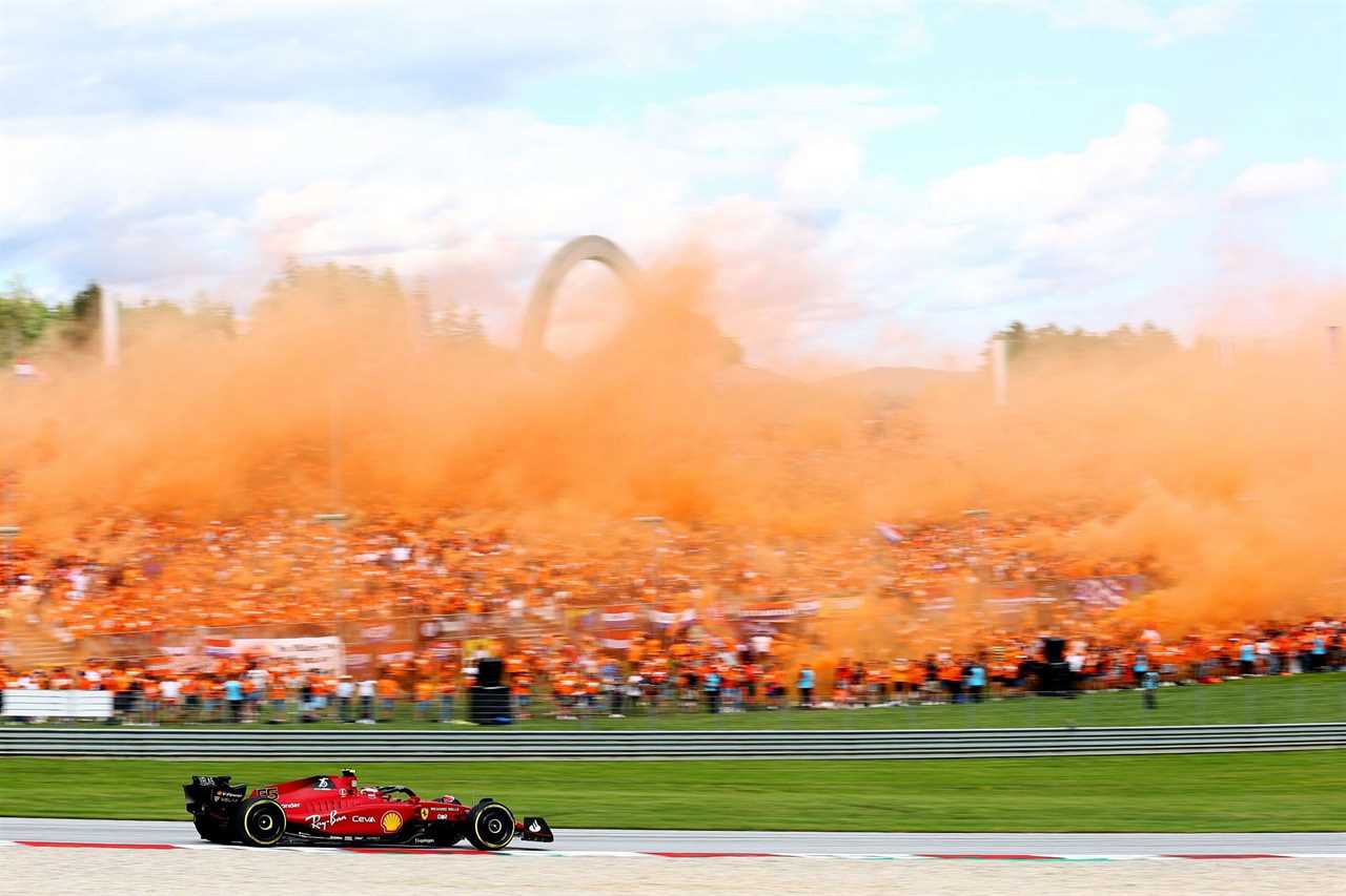 Carlos Sainz drives through the 'Oranje Army' smoke during the F1 Grand Prix of Austria Sprint at Red Bull Ring on July 09, 2022, in Spielberg, Austria (Photo by Clive Rose/Getty Images)