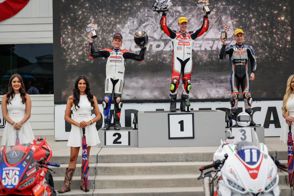 Jody Barry (center), Anthony Mazziotto (left), and Dominic Doyle (right) on the Twins Cup podium at Road America. Photo by Sara Chappell Photos, courtesy Aprilia.