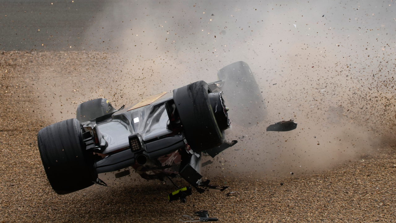 British GP Guanyu Zhou involved in scary first-lap crash as car turns upside down and hits barriers - watch