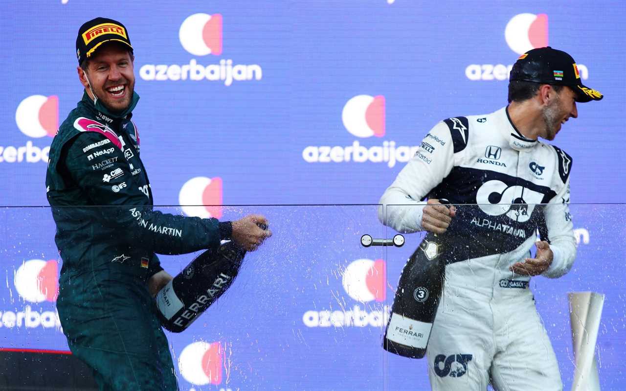 Sebastian Vettel and Pierre Gasly of France and Scuderia AlphaTauri celebrate on the podium during the F1 Grand Prix of Azerbaijan at Baku City Circuit on June 06, 2021 in Baku, Azerbaijan. (Photo by Mark Thompson/Getty Images)