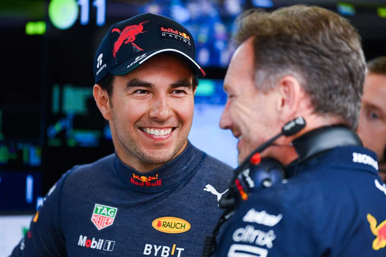 Sergio Perez (left) talks with Red Bull Racing team principal Christian Horner in the garage during final practice ahead of the 2022 F1 Azerbaijan GP (Photo by Dan Mullan/Getty Images)
