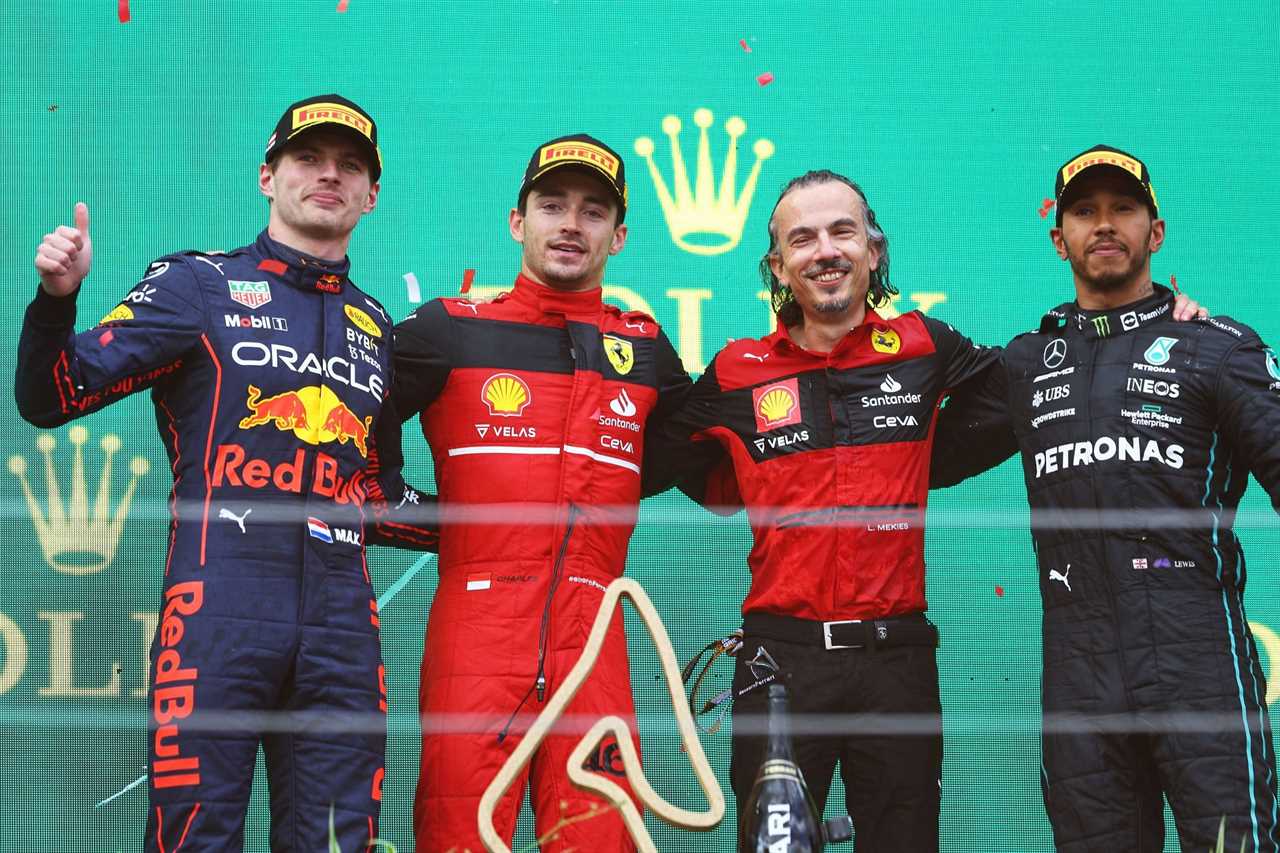 From L to R: Red Bull's Max Verstappen, Ferrari's Charles Leclerc and Laurent Mekies, and Mercedes' Lewis Hamilton on the podium at the 2022 F1 Austrian GP (Photo by Clive Rose/Getty Images)