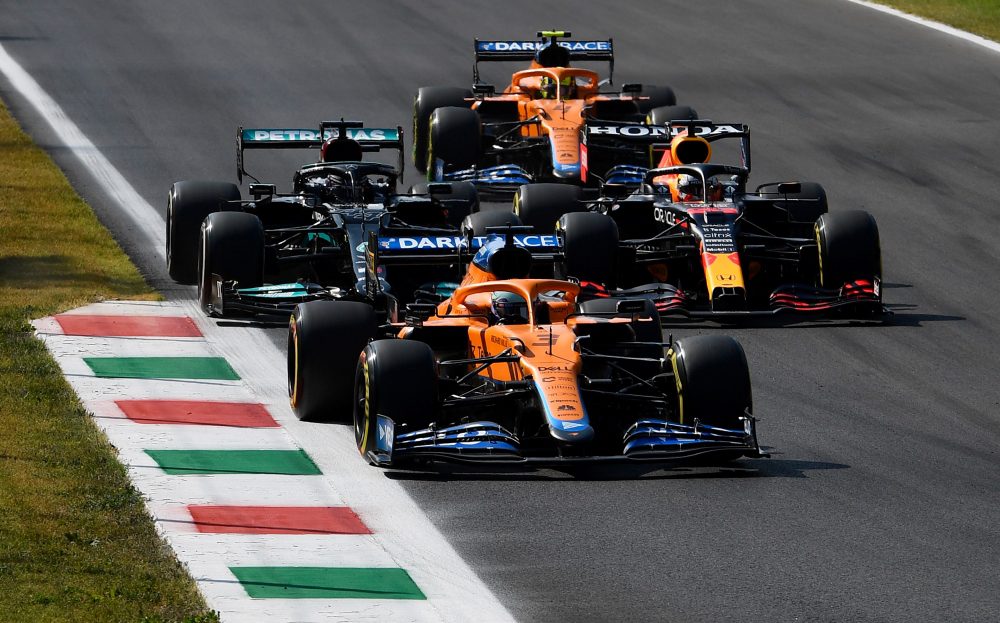 Daniel Ricciardo of Australia driving the (3) McLaren F1 Team MCL35M Mercedes leads Lewis Hamilton of Great Britain driving the (44) Mercedes AMG Petronas F1 Team Mercedes W12 and Max Verstappen of the Netherlands driving the (33) Red Bull Racing RB16B Honda on track during the F1 Grand Prix of Italy at Autodromo di Monza on September 12, 2021 in Monza, Italy. (Photo by Rudy Carezzevoli/Getty Images)