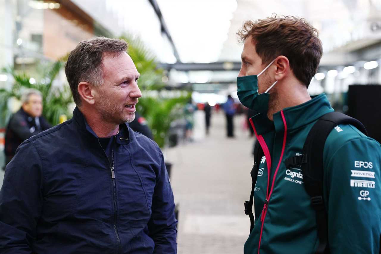 Red Bull Racing team principal Christian Horner (left) and Sebastian Vettel talk in the Paddock before practice ahead of the F1 Grand Prix of Brazil at Autodromo Jose Carlos Pace on November 12, 2021, in Sao Paulo, Brazil (Photo by Mark Thompson/Getty Images)