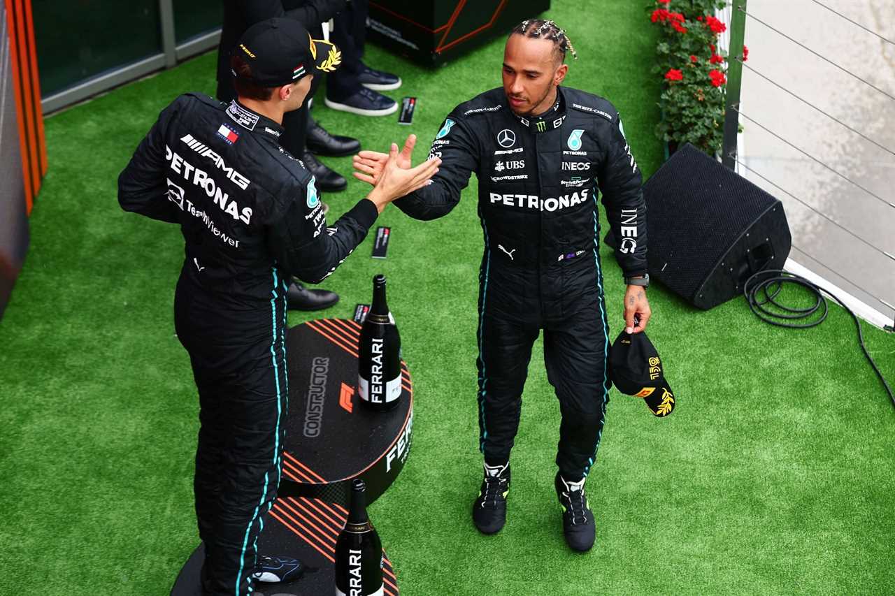 Mercedes drivers George Russell (left) and Lewis Hamilton (right) celebrate their double podium finish at the 2022 F1 Hungarian GP (Photo by Mark Thompson/Getty Images)