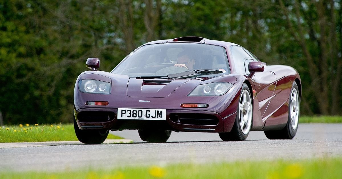 Red McLaren F1 driving on track