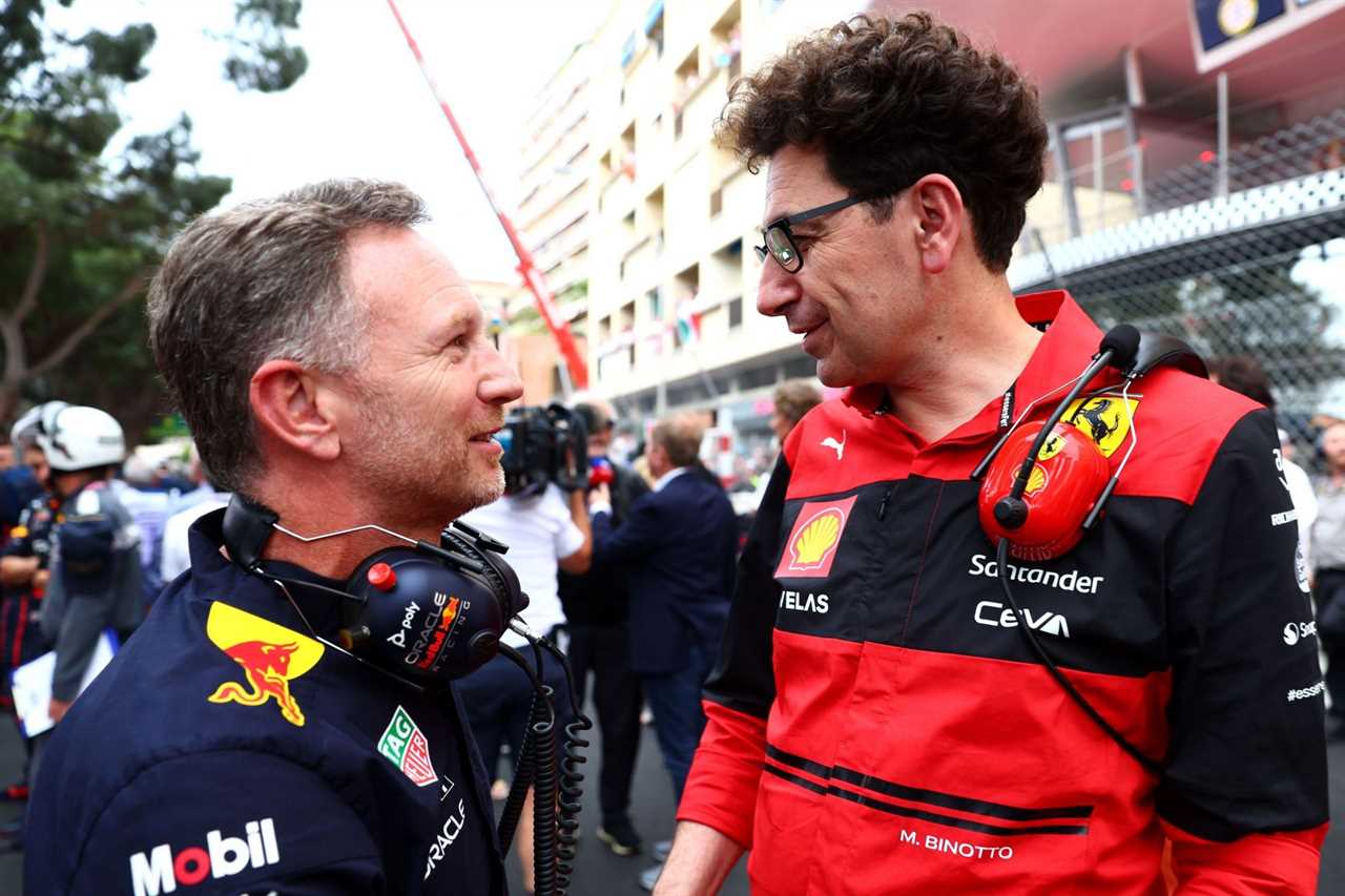 Red Bull team principal Christian Horner (left) and Ferrari team principal Mattia Binotto (right) speak to each other during the 2022 F1 Monaco GP weekend. (Photo by Mark Thompson/Getty Images)